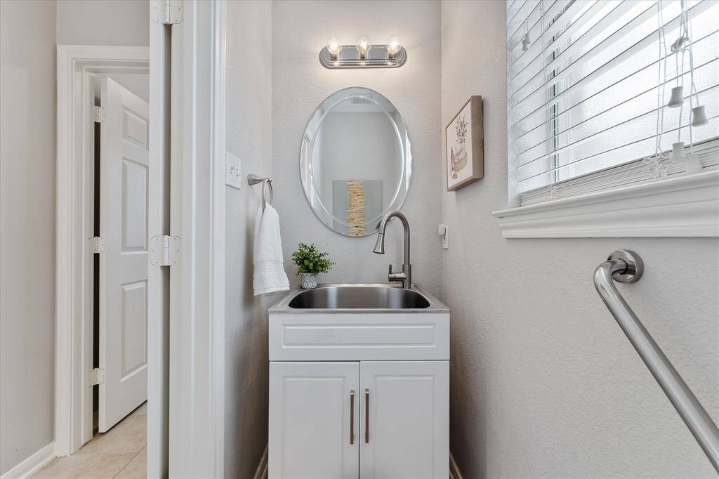 Updated powder room located off the laundry room