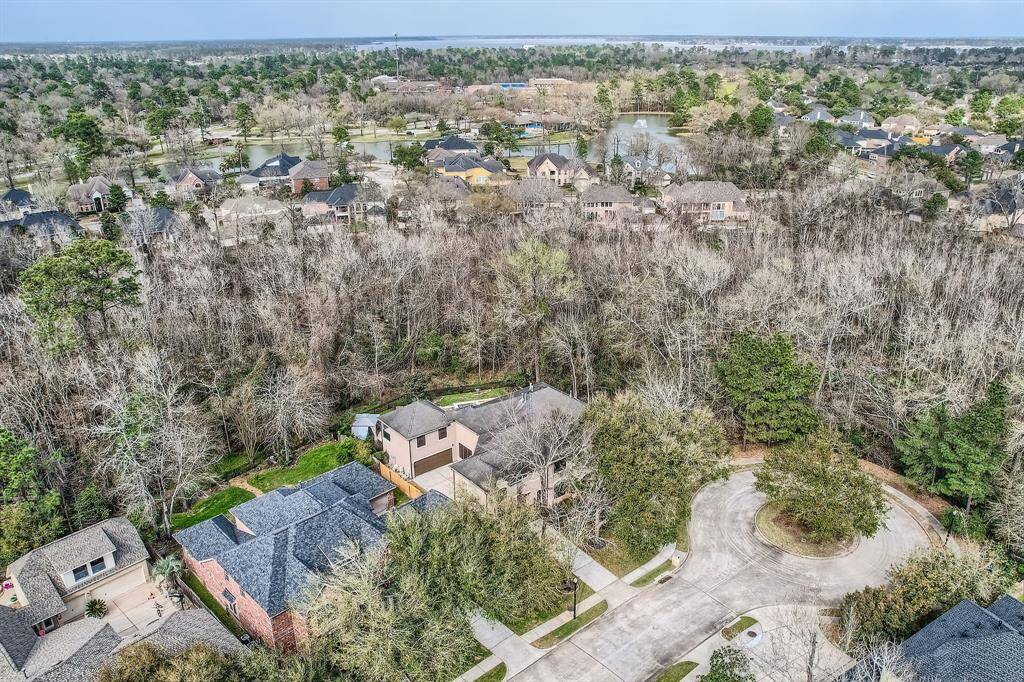 In this photo you can see the house sits at the end of the street on a cul de sac with natures preserve behind and to the right of the home.