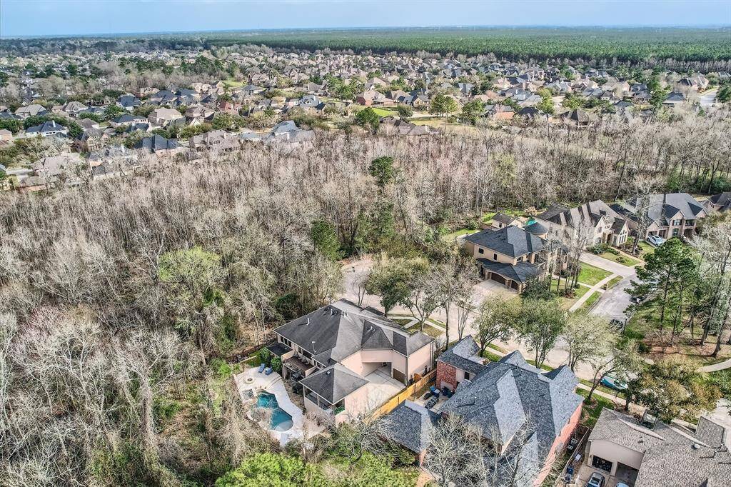 A gorgeous birds eye view from the back of the house with the pool.