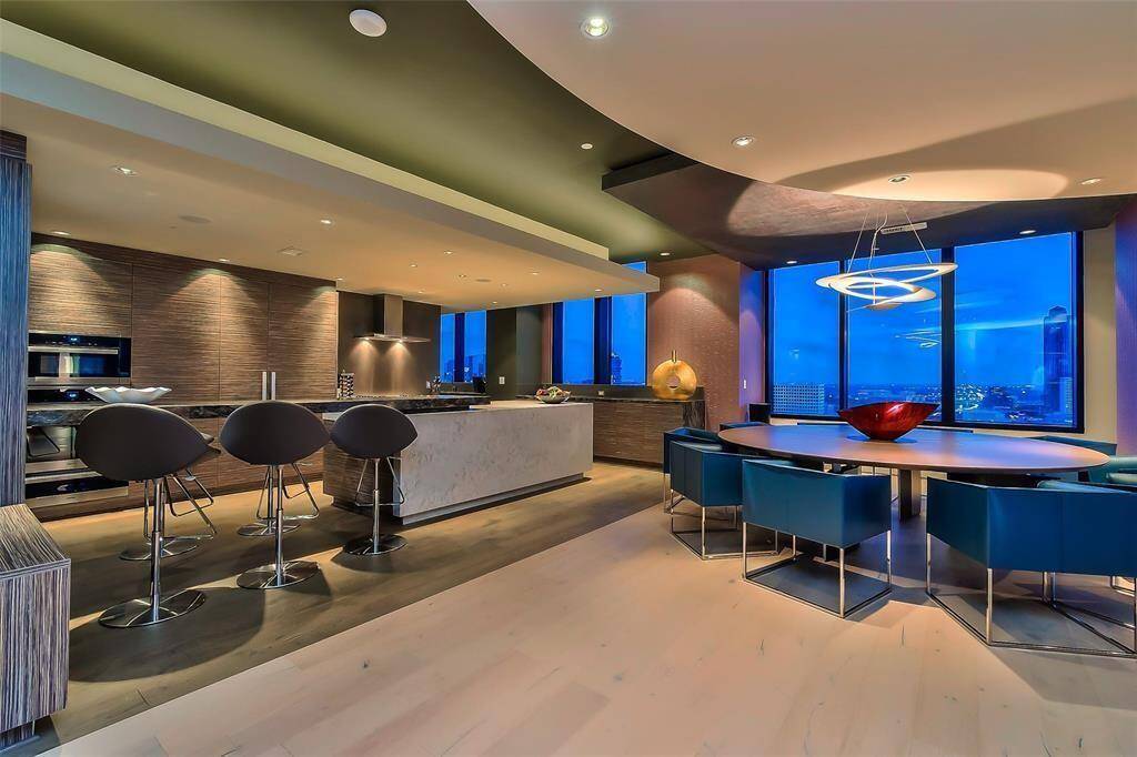 A Kitchen like no other in the building, Custom features, Custom Counters, all Top of the line appliances, capucchino machine, Look at the floors, and ceilings!!! 4 different ceiling styles!
