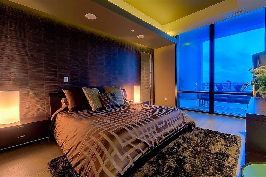 Master Suite with view to outside amazing patio, Look at the ceilings, special lighting, electric shades with both blackout and sheers!