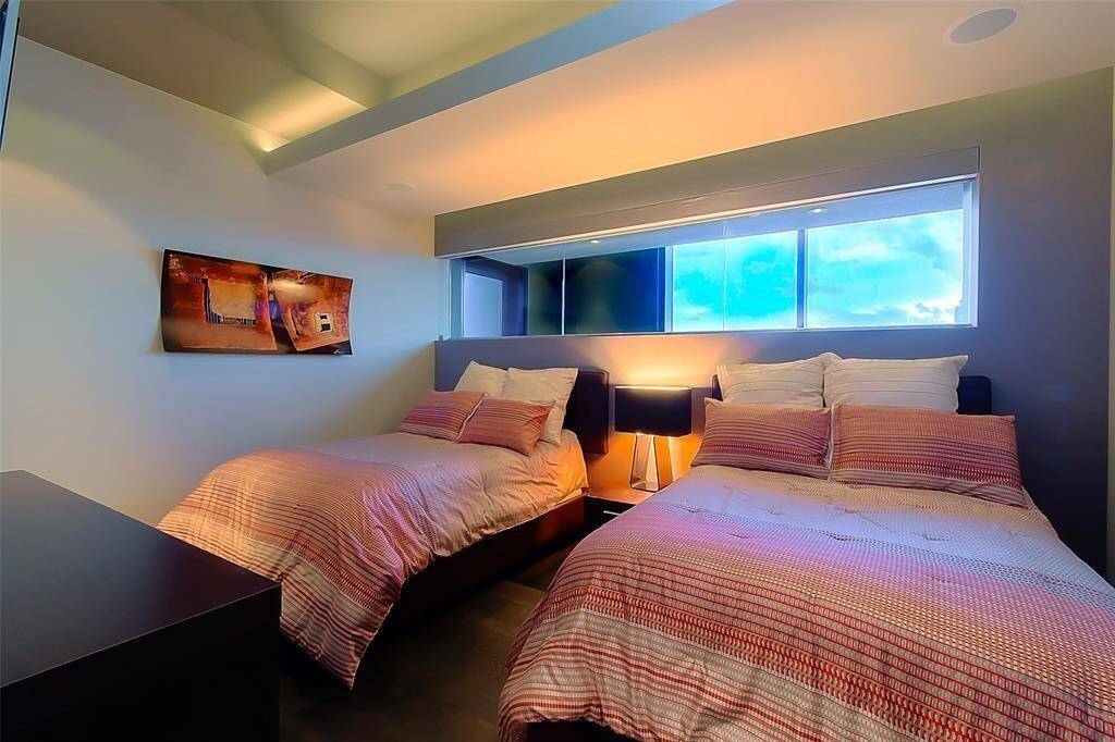 Bedroom # 3 big enough for 2 queen beds! look at the ceilings, all bedrooms have insuite baths.