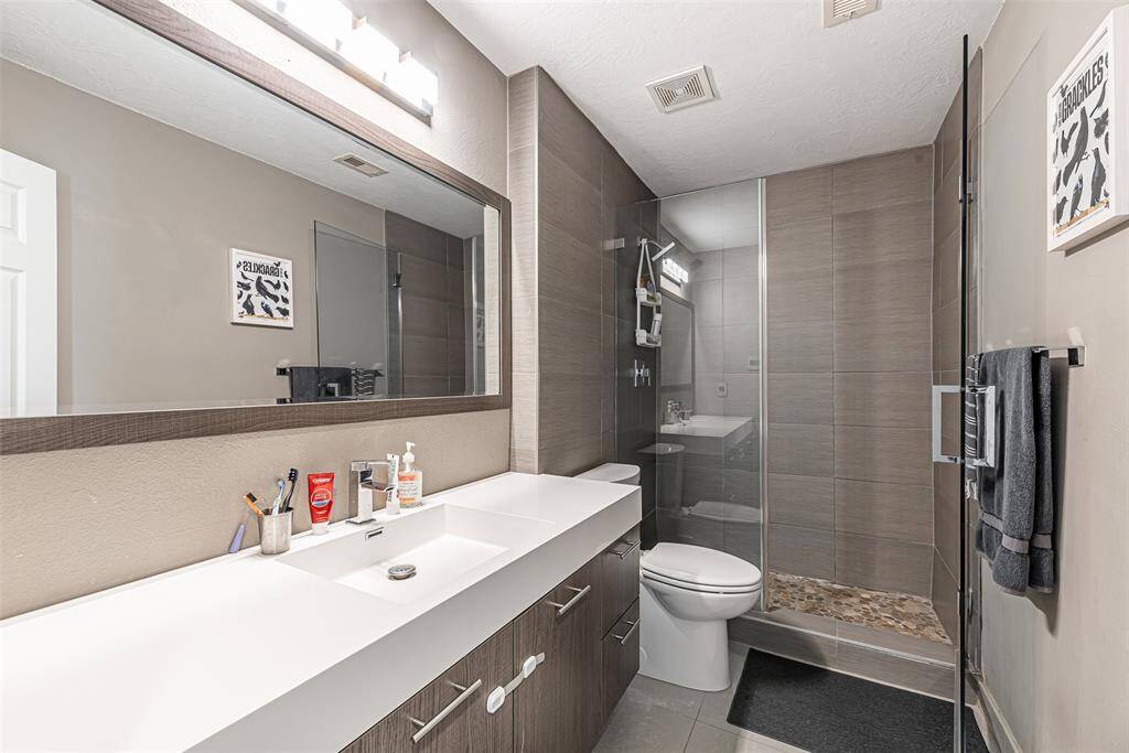 Secondary Bathroom with a stand-alone shower