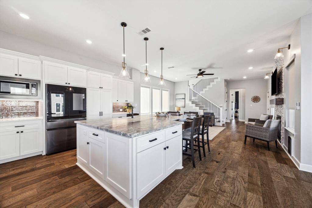 ANOTHER ANGLE FROM THE DINING ROOM CAPTURES THE BEAUTIFUL OPEN DESIGN.