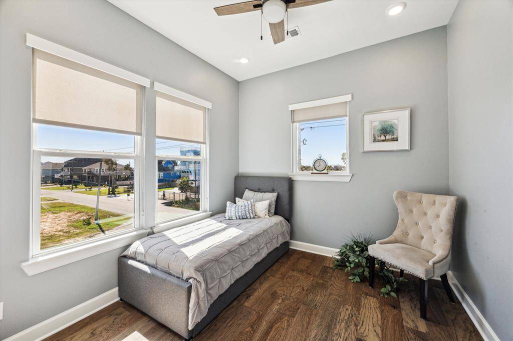 FIRST LEVEL GUEST ROOM WITH WOOD FLOORS AND A CLOSET FEATURES WATER VIEWS.