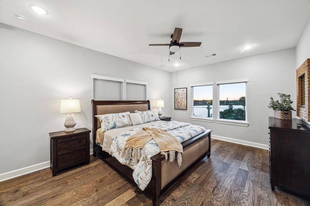THE 2ND LEVEL ALSO FEATURES A SECOND PRIMARY SUITE COMPLETE WITH WOOD FLOORS AND EN-SUITE BATH.