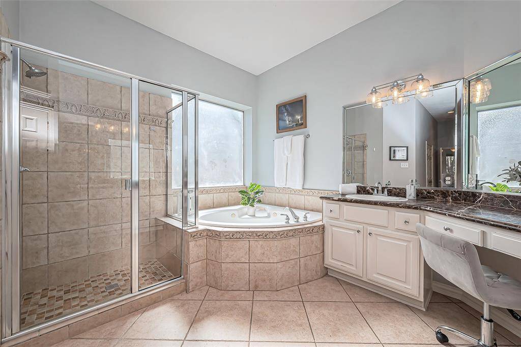 Another view of the light and bright primary bathroom.