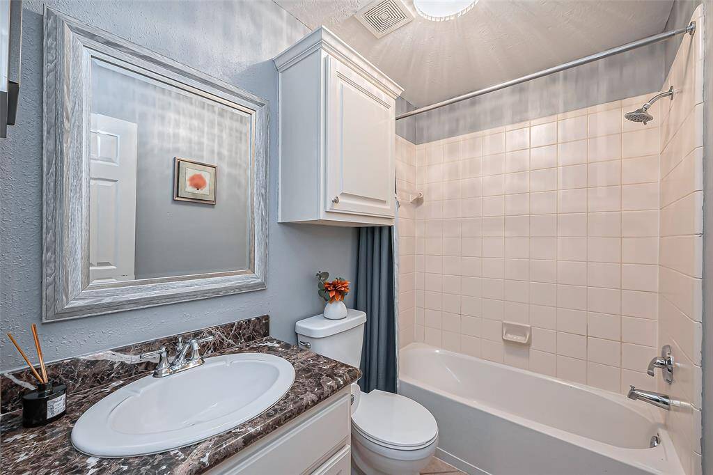 Bathroom #2 features a clean design and is located near the front of the home.