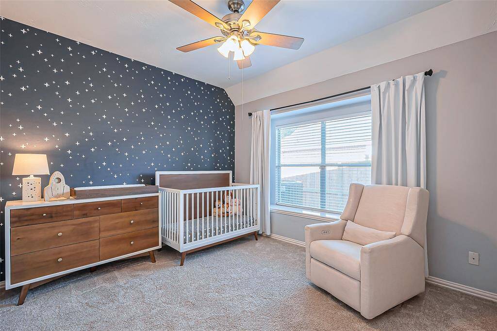 Bedroom #4 offers a delightful starry accent wall, perfect for a nursery or cozy retreat.
