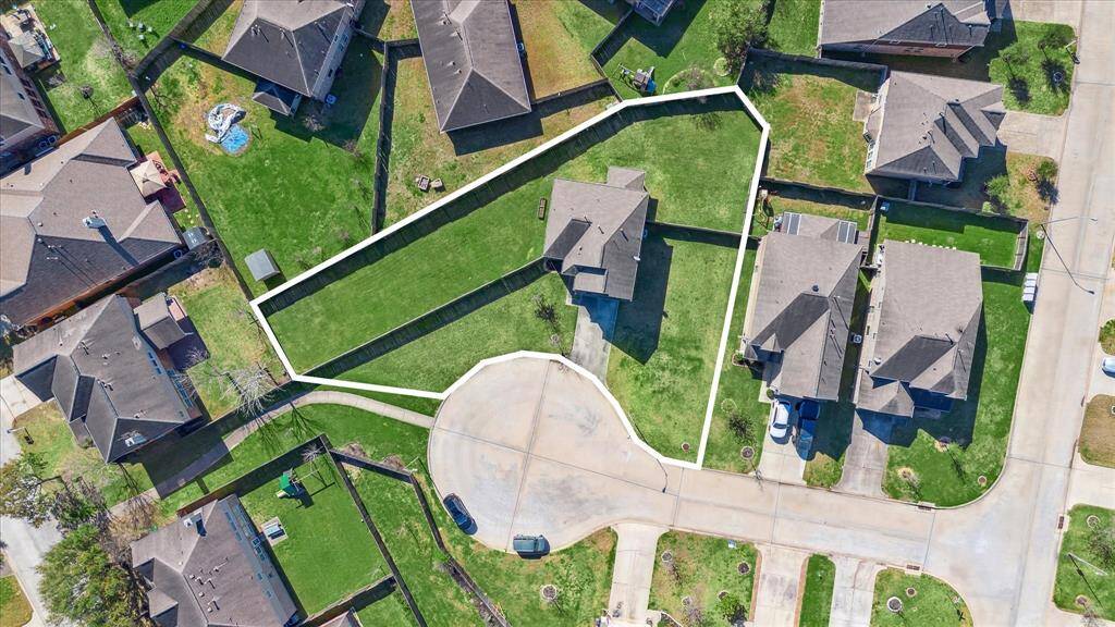 Zoned to Cy-Fair ISD award-winning schools, this cozy three-bedroom home is located on over a quarter-acre lot in Grant Meadows! This aerial view of the home and lot shows just how expansive the front, side and backyards are. The superimposed lot lines provide an approximate visual representation of the property lines and are meant for visual reference only. All measurements should be independently verified by purchaser.
