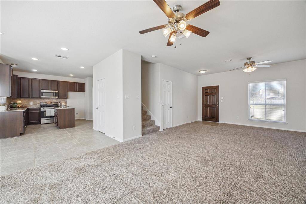 Rich earth-toned cabinetry and tonal carpet, tile, and paint ensure a neutral backdrop for your furnishings and creativity.