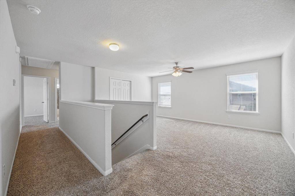 Just off the upstairs landing, this large flex area provides an extra living space perfect for a media room, study area, or a family game room.