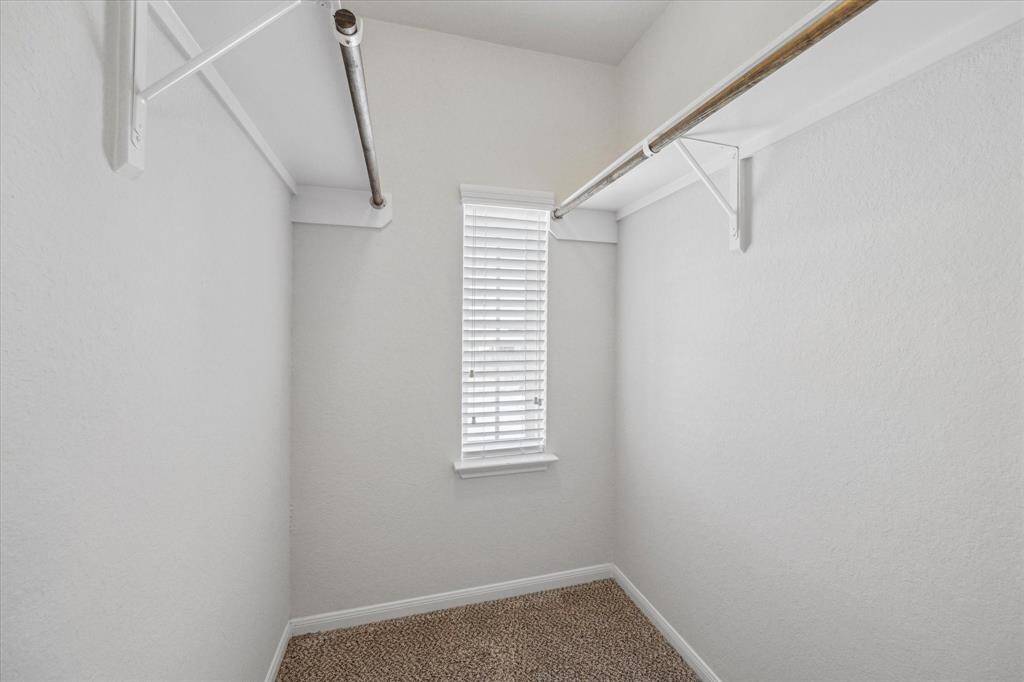 One of two closets located off the primary bathroom.