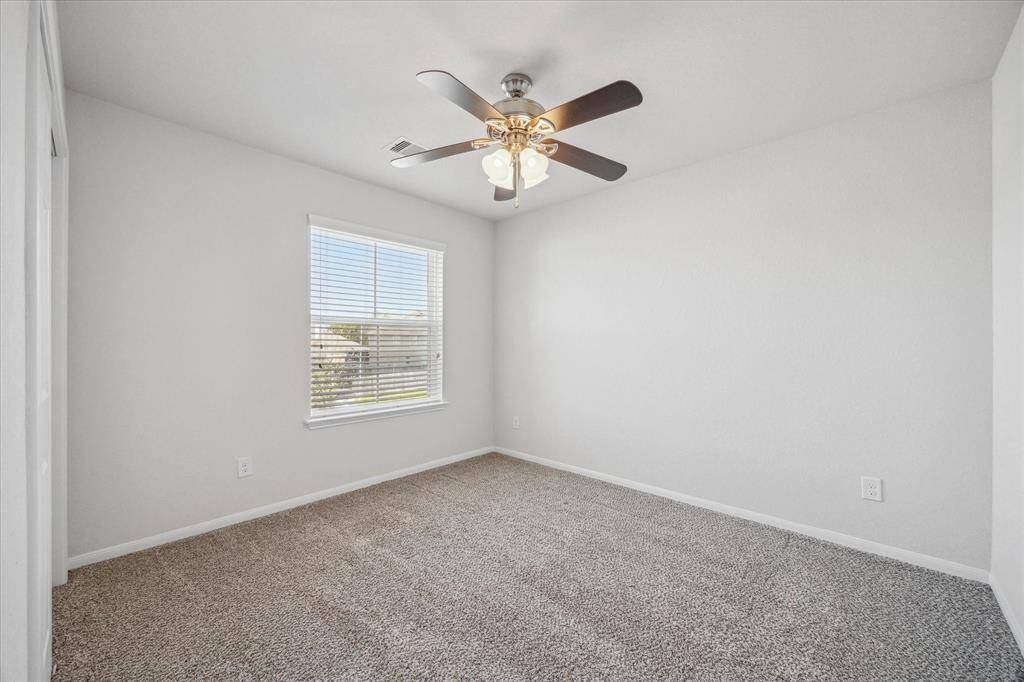 One of two secondary bedrooms located upstairs.