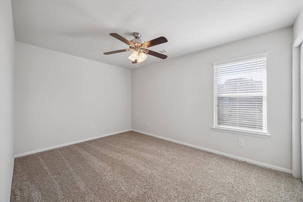 One of two secondary bedrooms located upstairs.