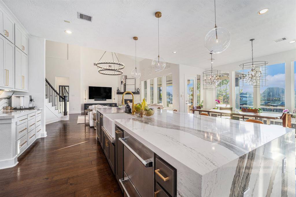 Double dishwasher, farmhouse sink with drip ledge, touchless faucet, reverse osmosis drinking water system with insta-hot, and an oversized walk-in pantry for max storage.