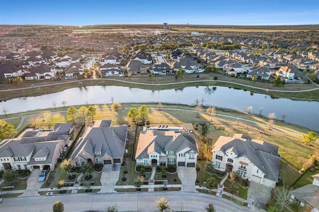 Two-story delight located in the Hidden Creek section of Lakeland Village within the prestigious Bridgeland Community in Cypress, TX. This stunning home offers spacious entertaining and living space, featuring 4 bedrooms and 4.5 bathrooms.