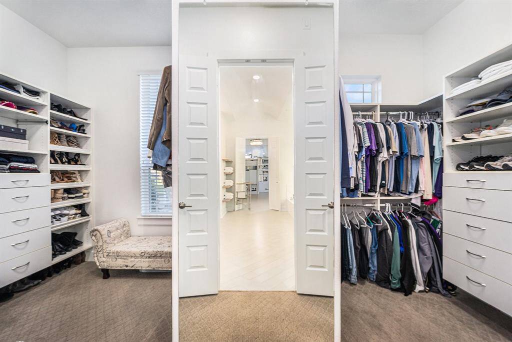 His & Hers Closets - Built-in storage, natural light.