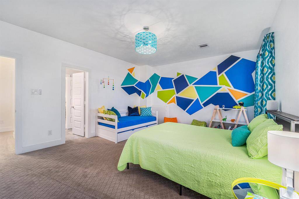 Secondary bedroom #3 - boasts a one-of-a-kind hand-painted mural that adds a personal touch and creative flair to the space.