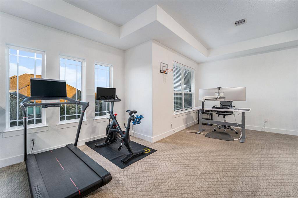 The upstairs media room and playroom have been freshly painted within the last year, offering a fresh and updated aesthetic. Workout space / flex space makes this home fit your every need.