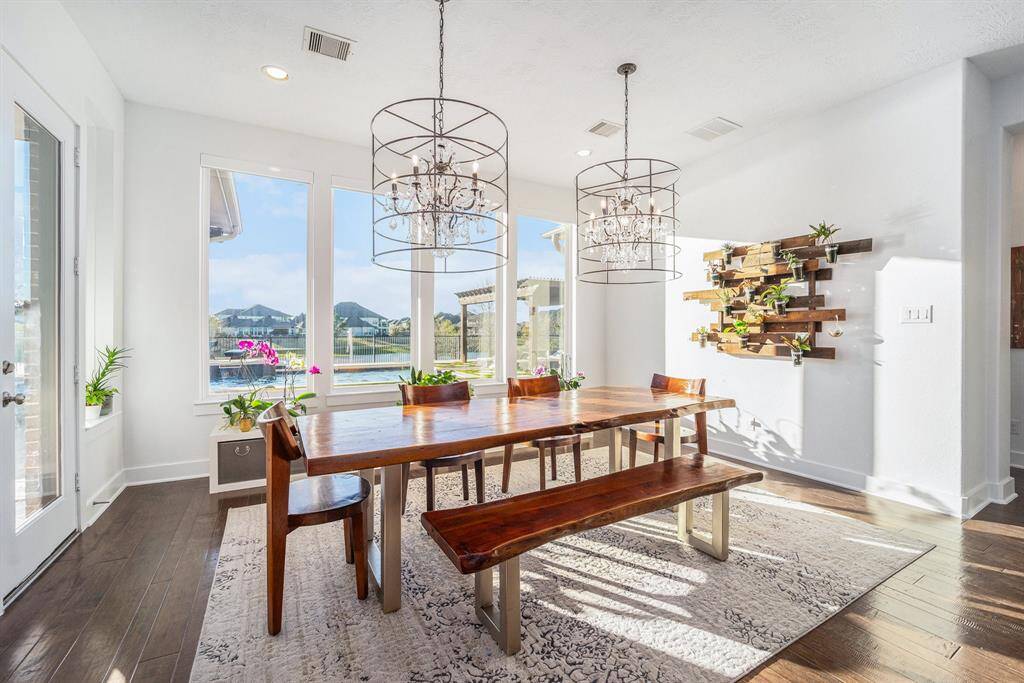 Dining Room - Natural light, living wall, custom lighting, double chandeliers.