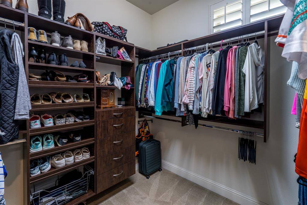 There is plenty of room in two connecting California closets for you to organize your personal belongings in style!