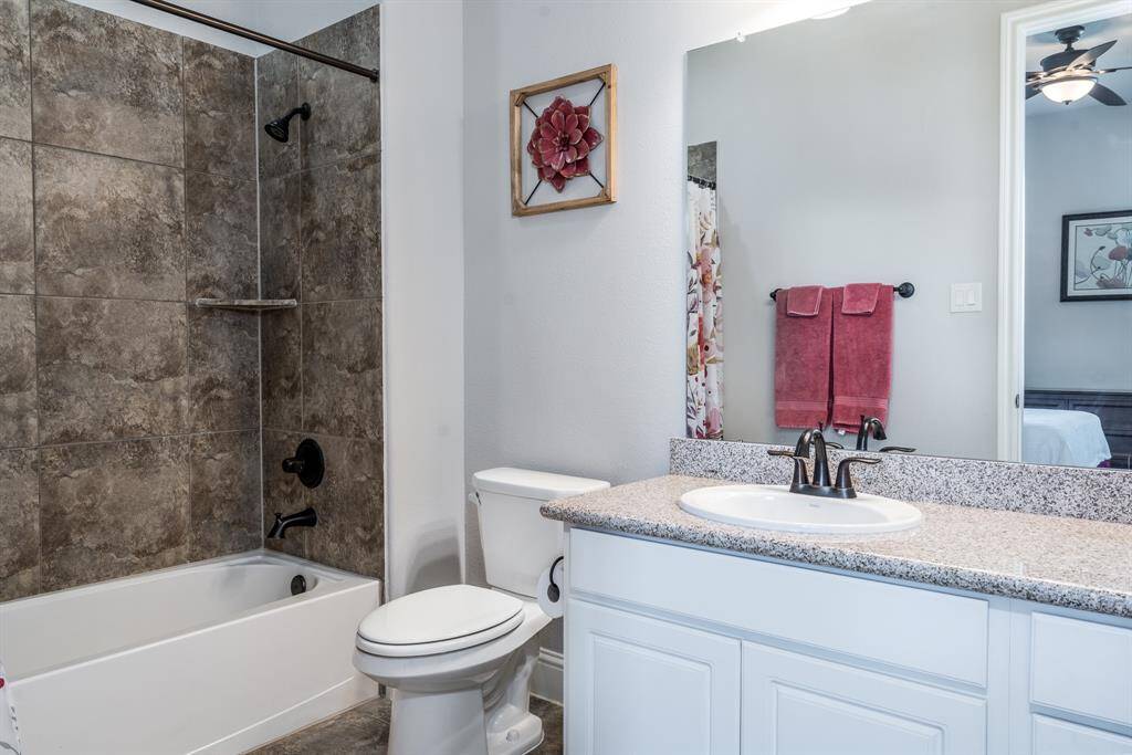 This private full bath with shower/tub combo and tile surround awaits residents and guests to start or end their day!