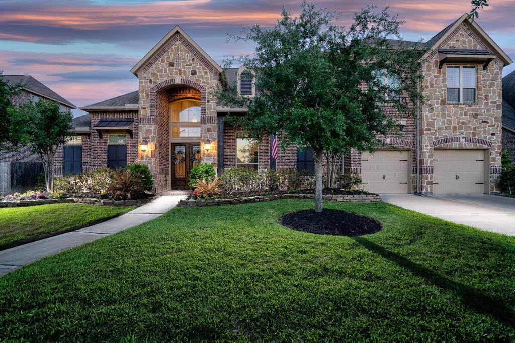 This spectacular home exudes warmth and is just as inviting at twilight as it is in daylight!