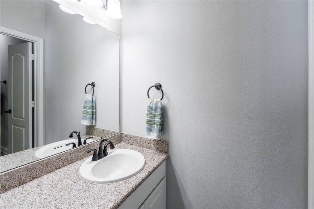 The private vanities are complete with large mirrors and plenty of cabinet and drawers for your storage needs!