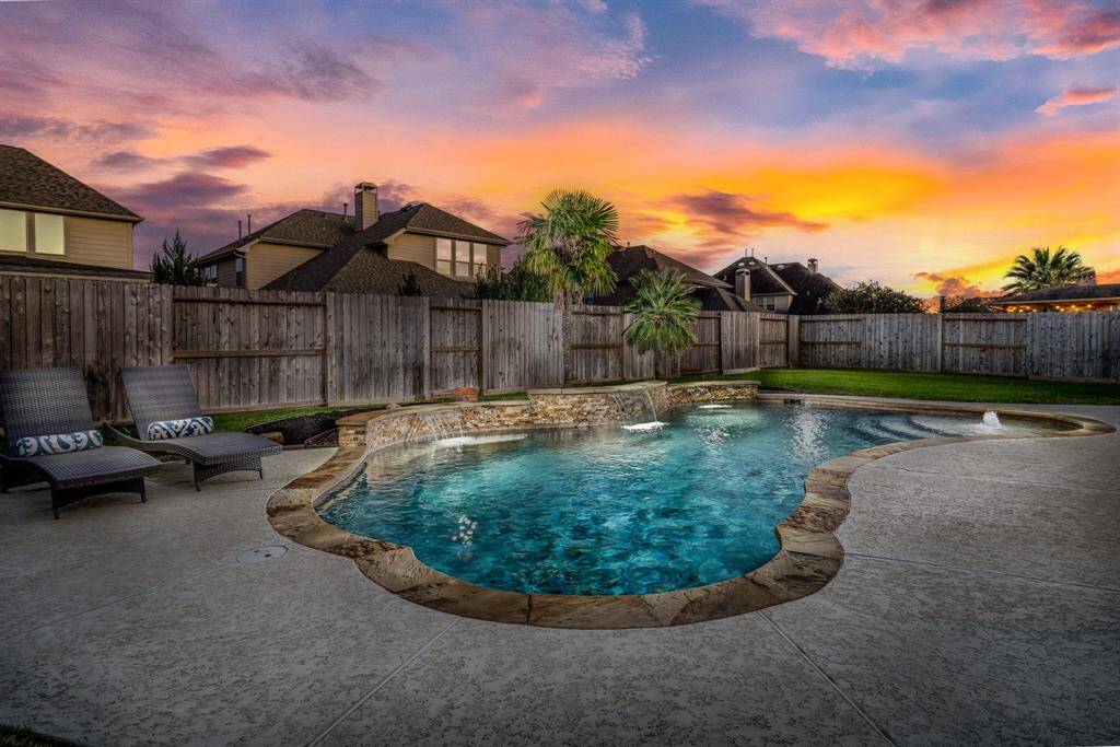 Welcome to your backyard paradise! Imagine twilight swims in this spectacular space!