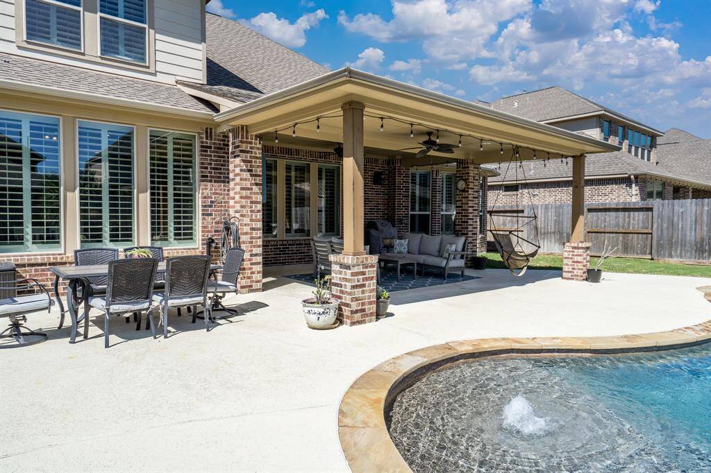 The 19 x 20-foot extensive covered patio is the ultimate place to gather for an afternoon by the pool!
