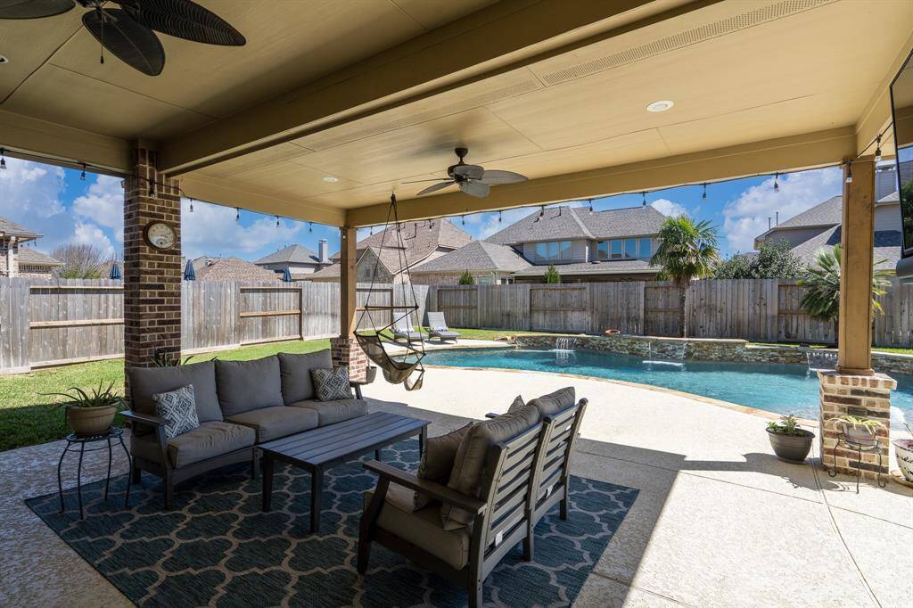 Imagine entertaining friends and family under this fabulous, covered space that offers 2 ceiling fans, recessed lighting, and an abundance of shade to beat the Texas heat!