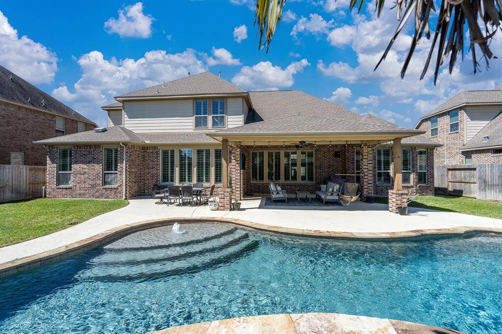 This view from the rear of the property highlights the backyard oasis that awaits!