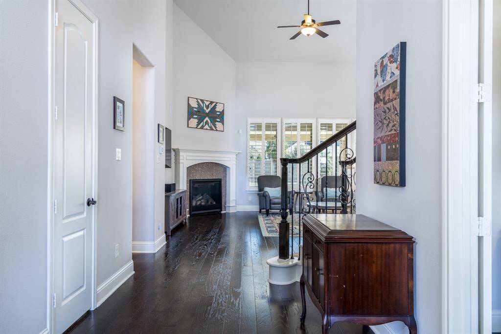 Step inside this 2-story entry with hand scraped hardwood floors that flow through the main living areas, creating a warm and welcoming space!