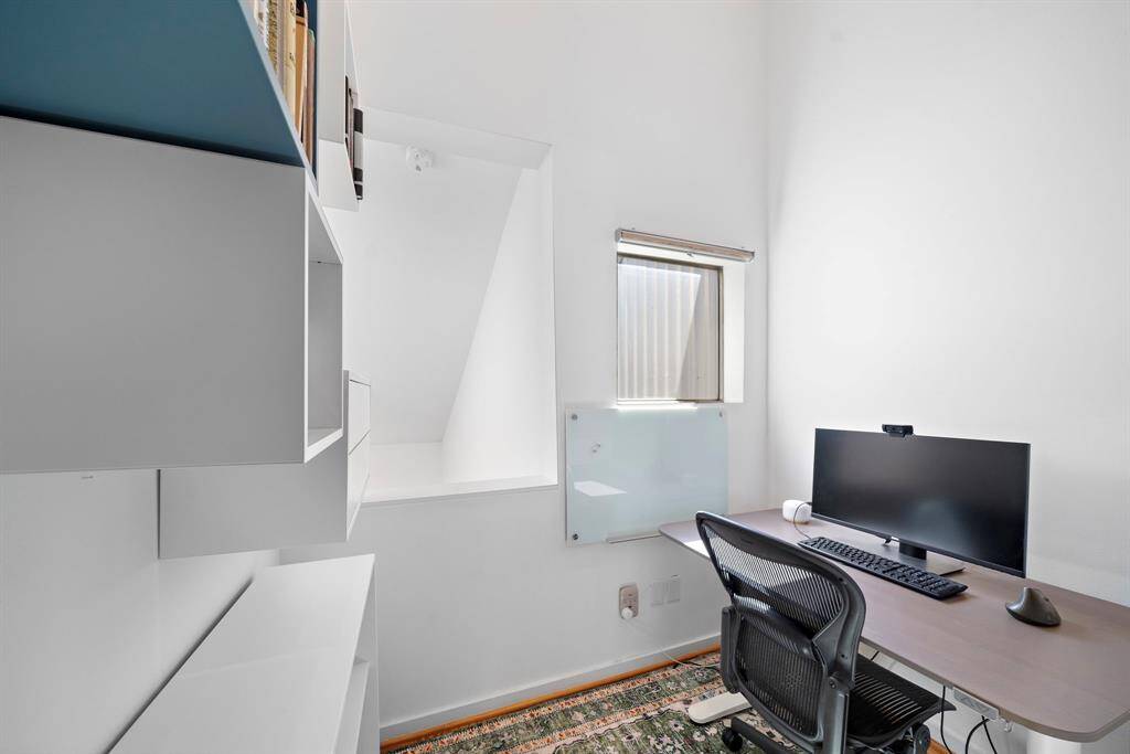 This little nook off the primary bedroom is perfect for an office, reading nook, additional storage space or a nursery.