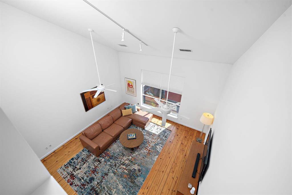 The view down to the living room from the extra room off the primary bedroom.