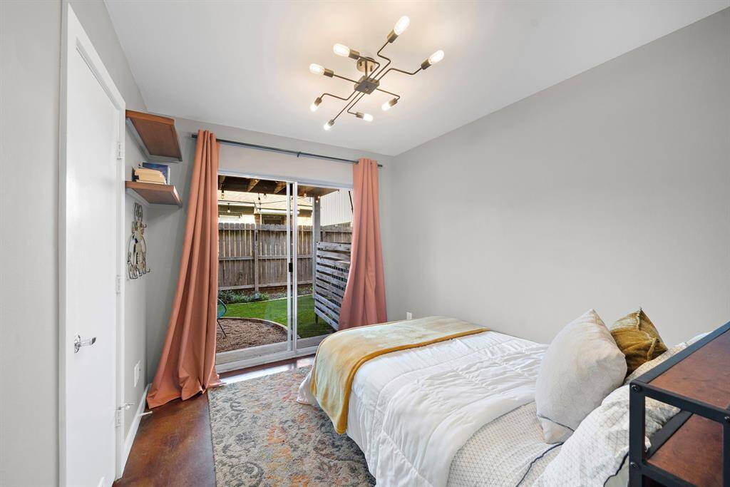 Bedroom #2 on the first floor has access to the amazingly manicured backyard.
