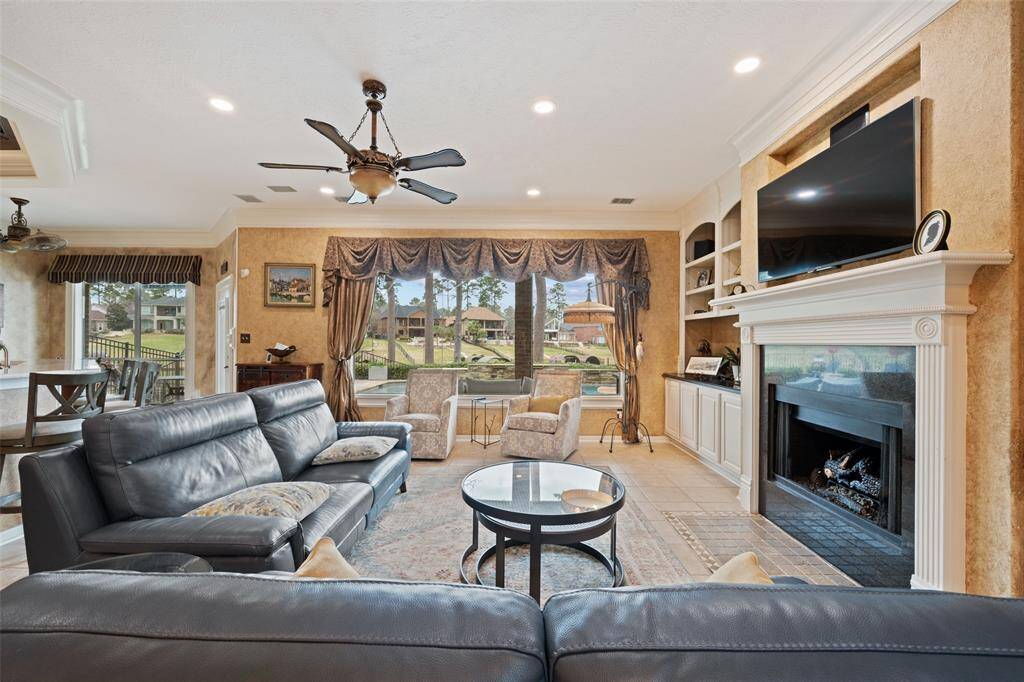 ELEGANT FAMILY ROOM, GAS FIREPLACE AND VIEWS TO THE LAKE, REMOTE CONTROLLED ELECTRONIC WINDOW COVERINGS