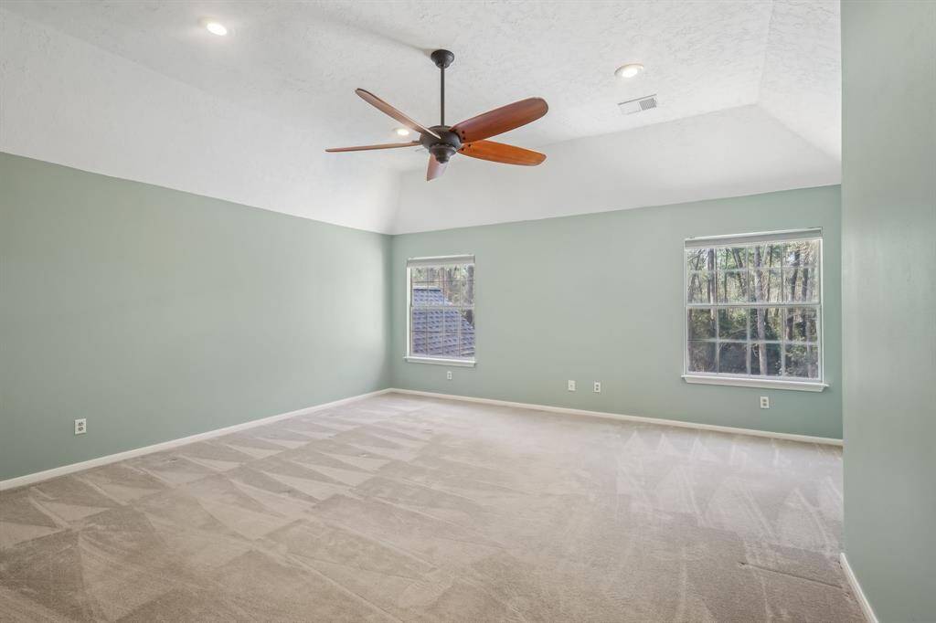 Spacious upstairs game room with closet, easily convertible into a sixth bedroom.