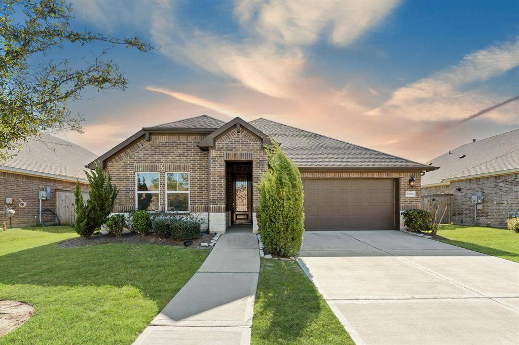 A welcoming first impression begins with the manicured lawn and beautifully maintained front yard, offering stunning curb appeal.