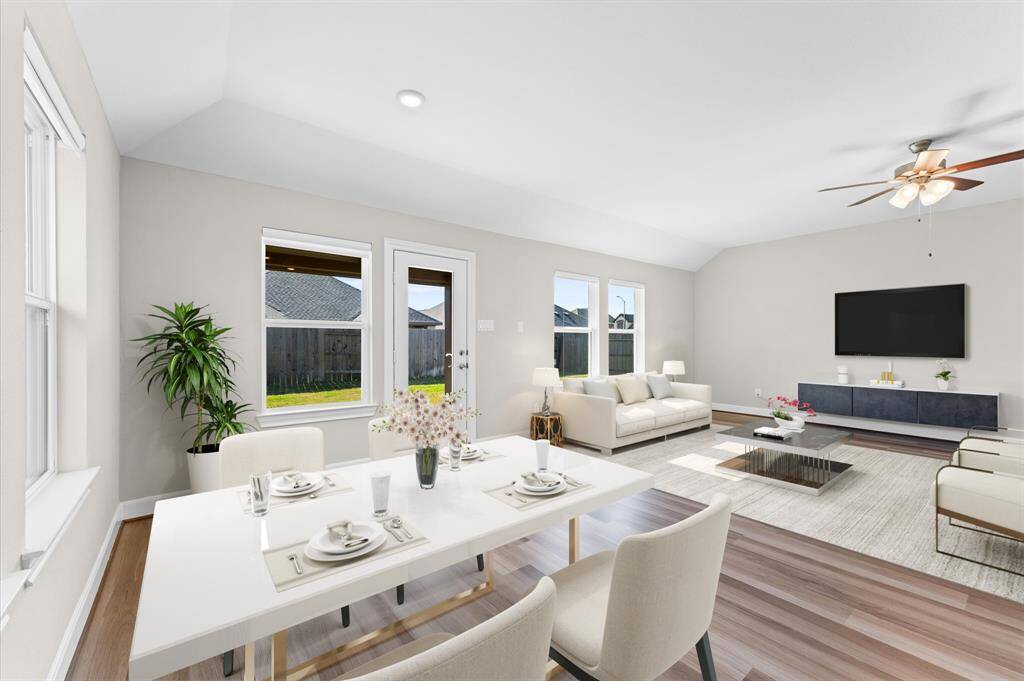 The open-concept design connects seamlessly to the kitchen and dining area, making it ideal for entertaining or unwinding with loved ones.