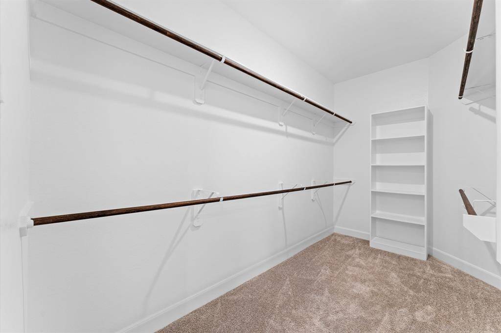 The walk-in closet is as functional as it is spacious, providing plenty of room to organize your wardrobe.