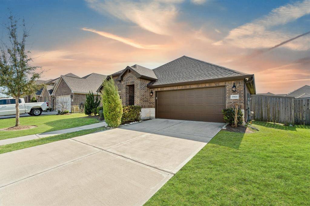 The huge driveway provides ample space for parking, making it convenient for family and guests alike.