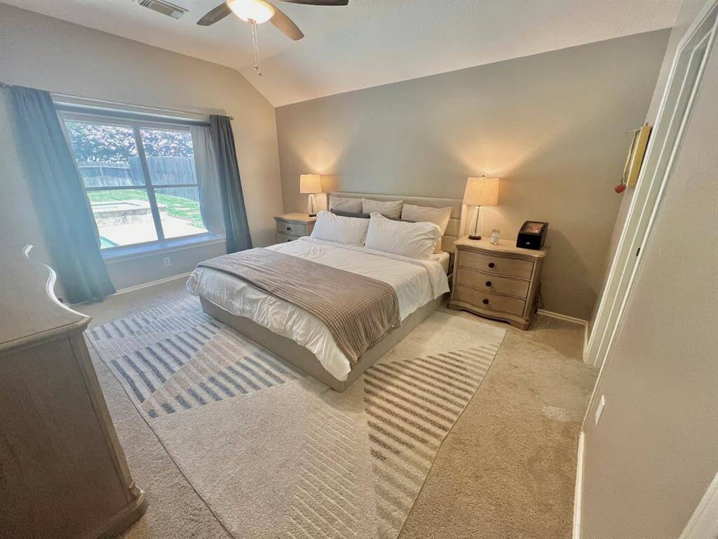 Main bedroom on the first floor with views of the pool.