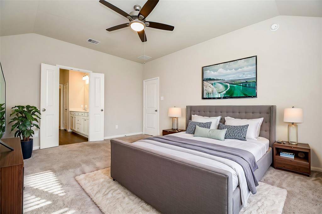 Bright and airy master bedroom with a ceiling fan for added comfort. Virtually Staged
