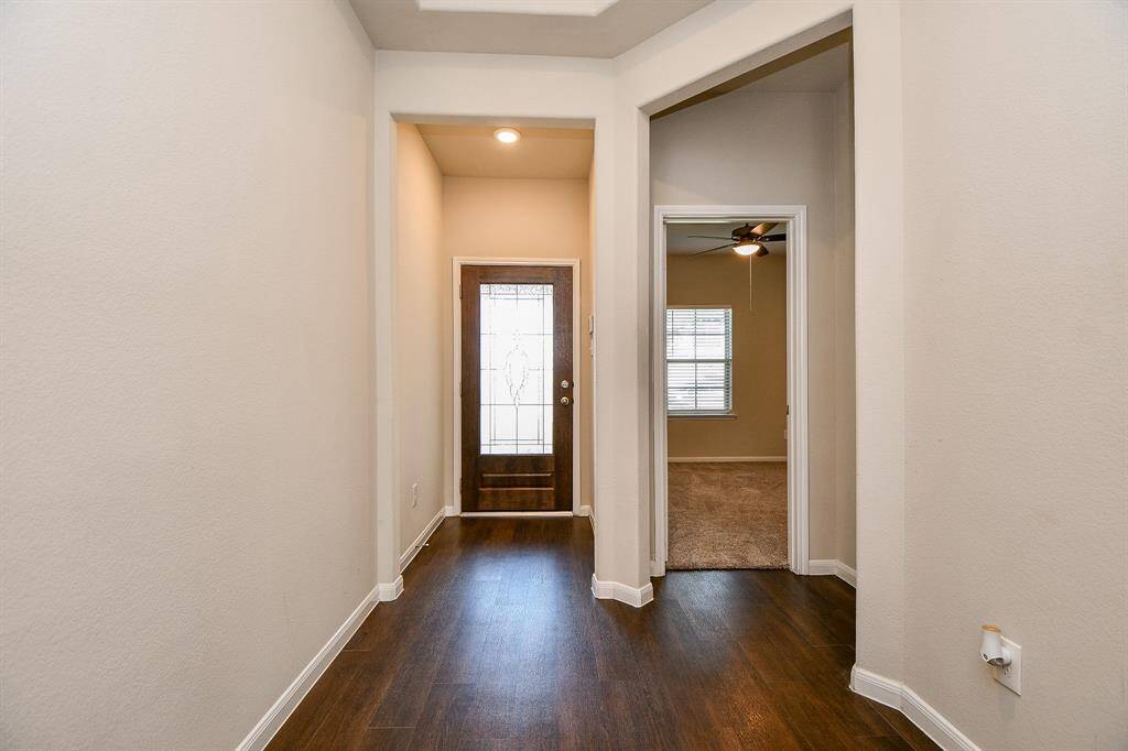 Inviting front door floods the space with natural light.