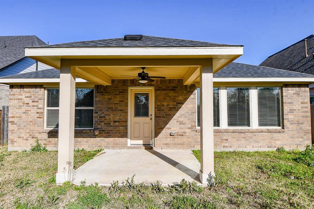 Relax or entertain on the breezy back patio, complete with a ceiling fan for comfort.