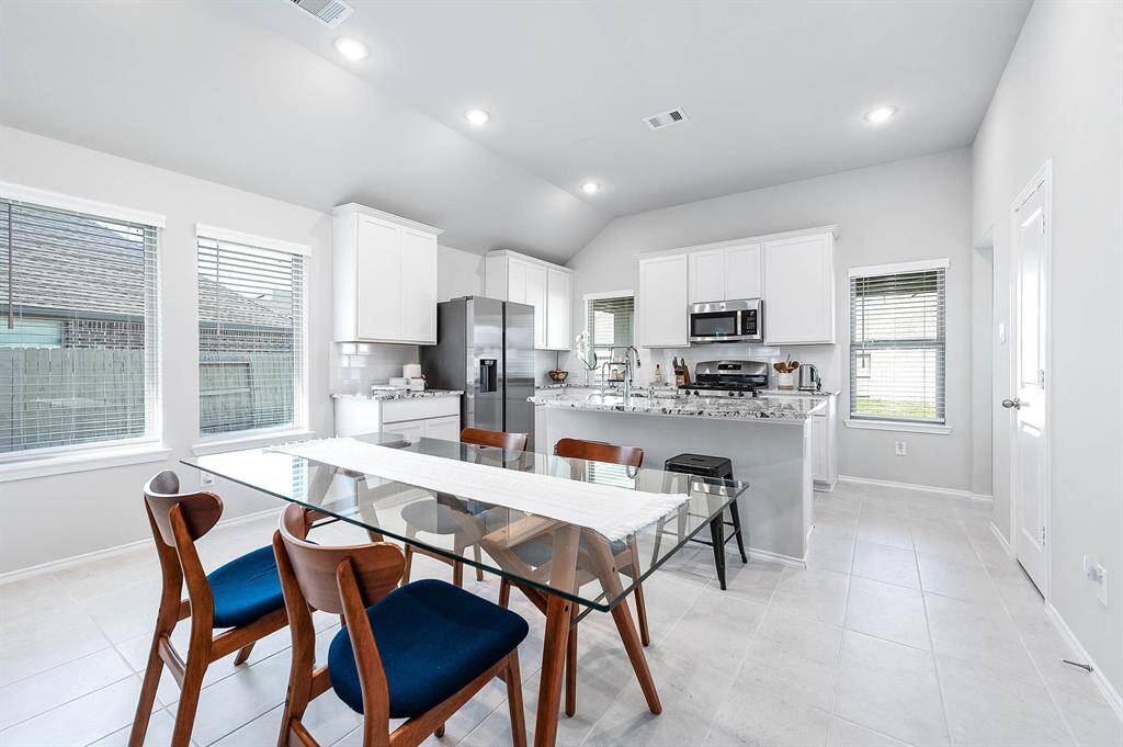 Dining room meets Kitchen with breakfast bar for extra seating.