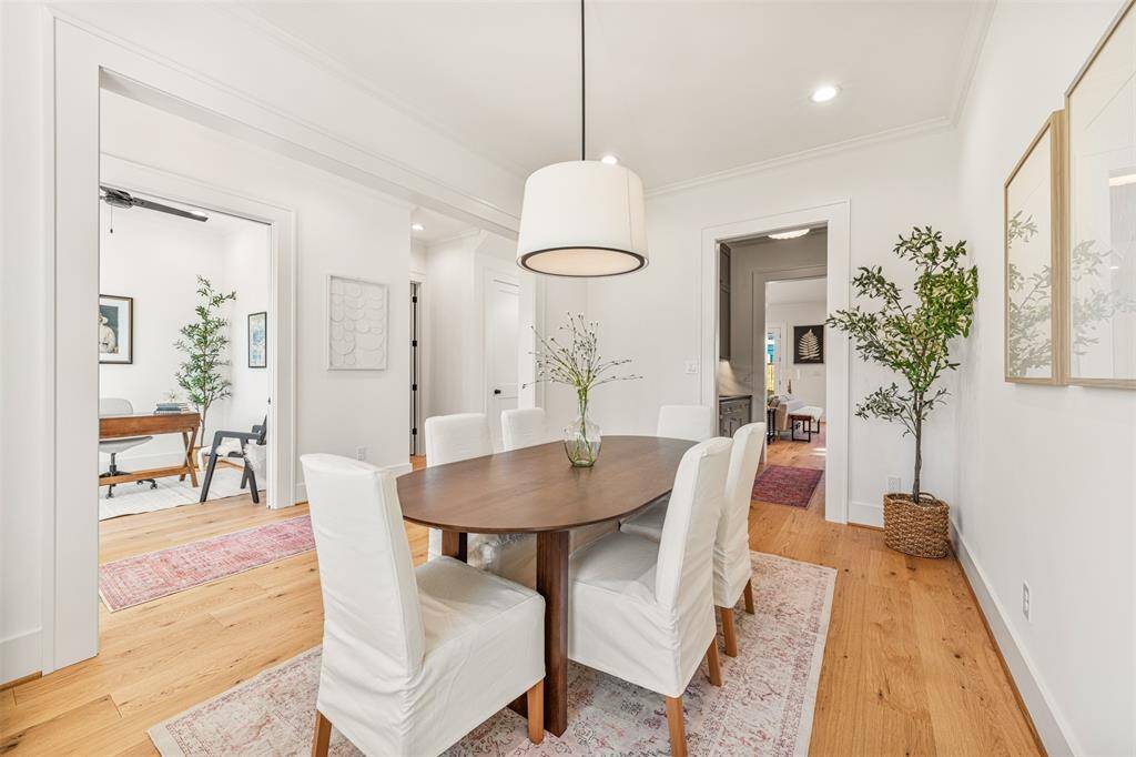 An inviting dining room designed for memorable gatherings, blending warm textures with refined elegance.