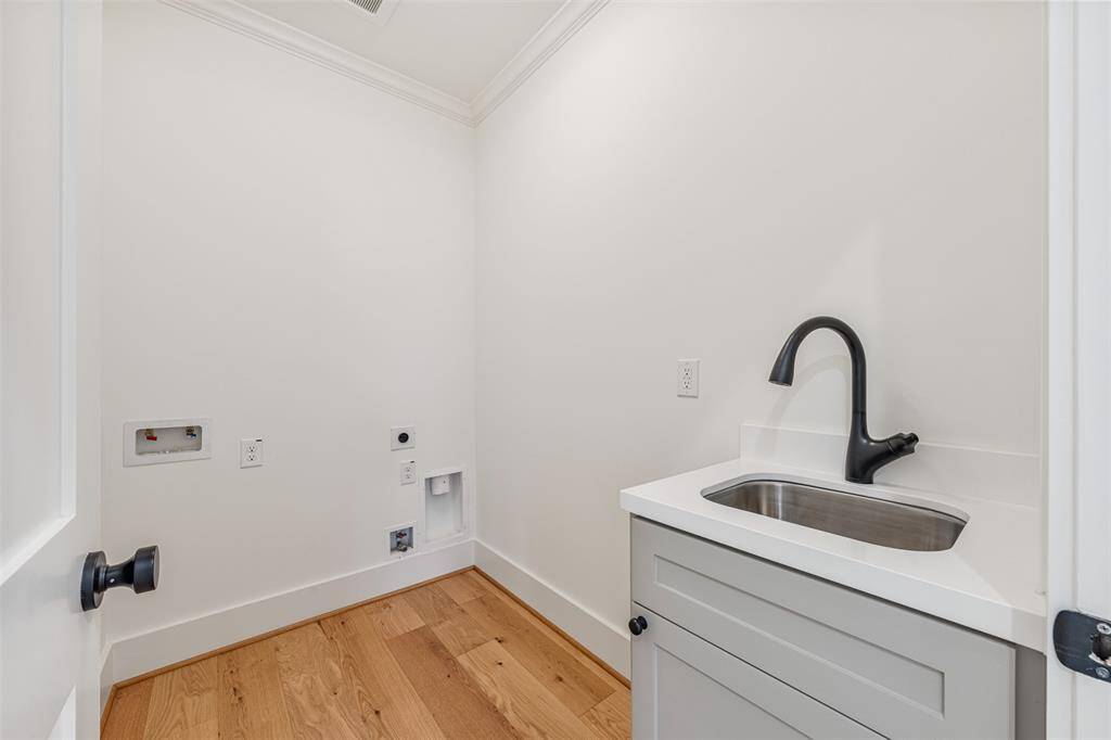 A second-floor laundry room designed for convenience.